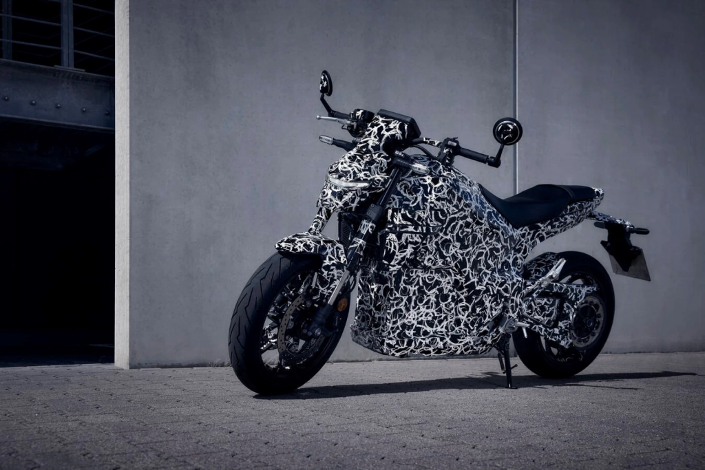 Honda teases its first in-house electric motorcycle, the EV Fun Concept, a CB500 Hornet-inspired roadster with CCS2 fast charging, over 120 miles of range, and a likely 2025 launch.