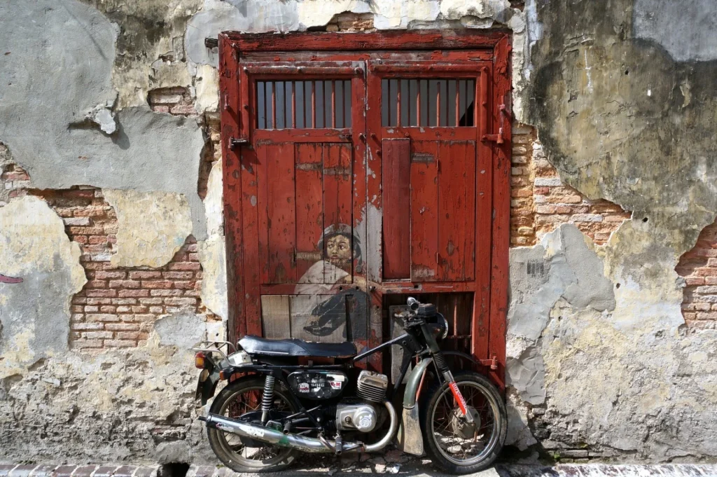 Why do Penang people have to ride motorbikes?